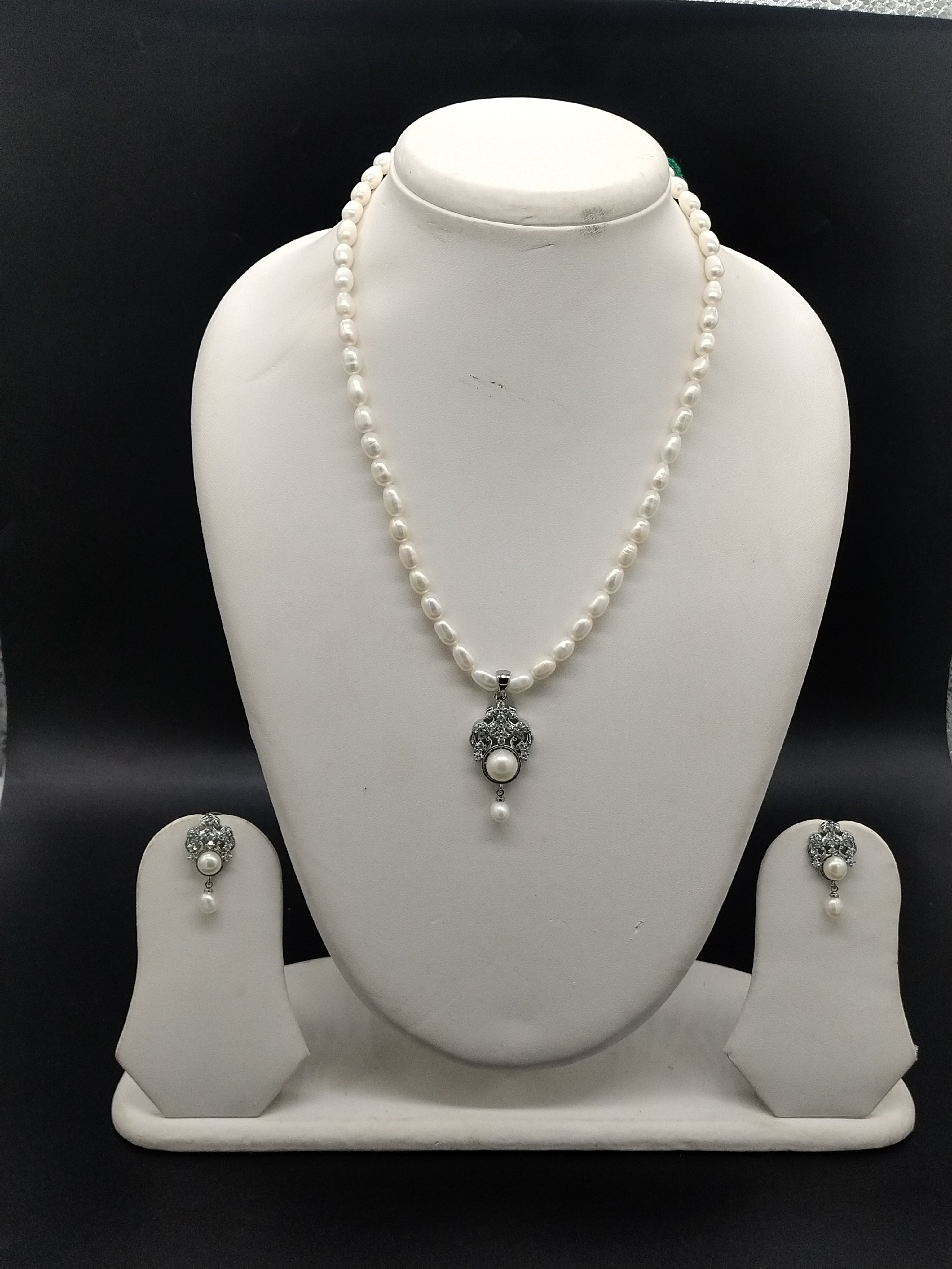 AAA freshwater oval pearl one line pendant necklace set with silver floral design and matching earrings
