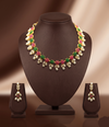 AD stone and freshwater pearl necklace set with red and green American Diamond stones, pearl drops, and matching earrings.
