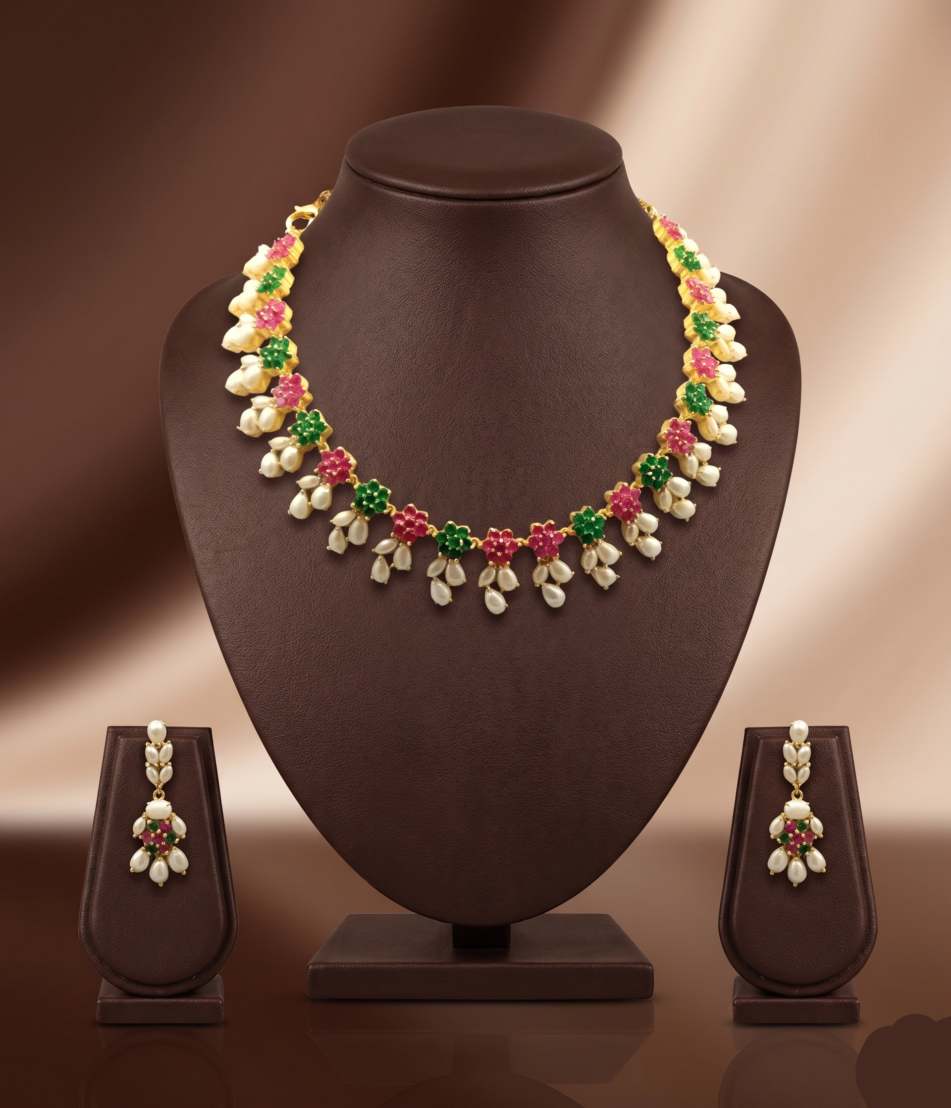 AD stone and freshwater pearl necklace set with red and green American Diamond stones, pearl drops, and matching earrings.