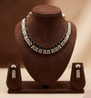 Blue AD stone and freshwater pearl choker set with dual-row design and matching stud earrings.