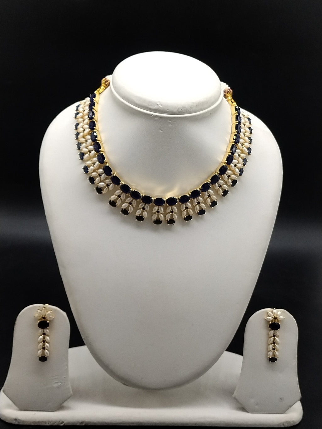 Blue AD stone and freshwater pearl choker set with dual-row design and matching stud earrings.