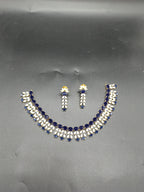 Blue AD stone and freshwater pearl choker set with dual-row design and matching stud earrings.