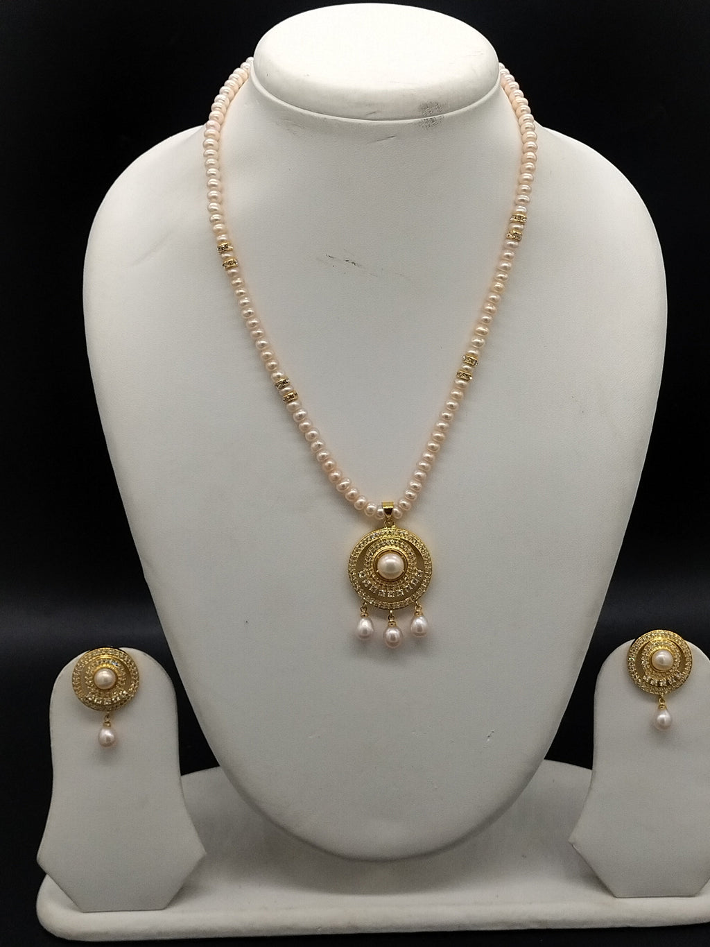 Blush Aura freshwater pearl pendant necklace set with pink flat pearls and gold circular pendant with pearl drops