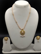 Blush Aura freshwater pearl pendant necklace set with pink flat pearls and gold circular pendant with pearl drops