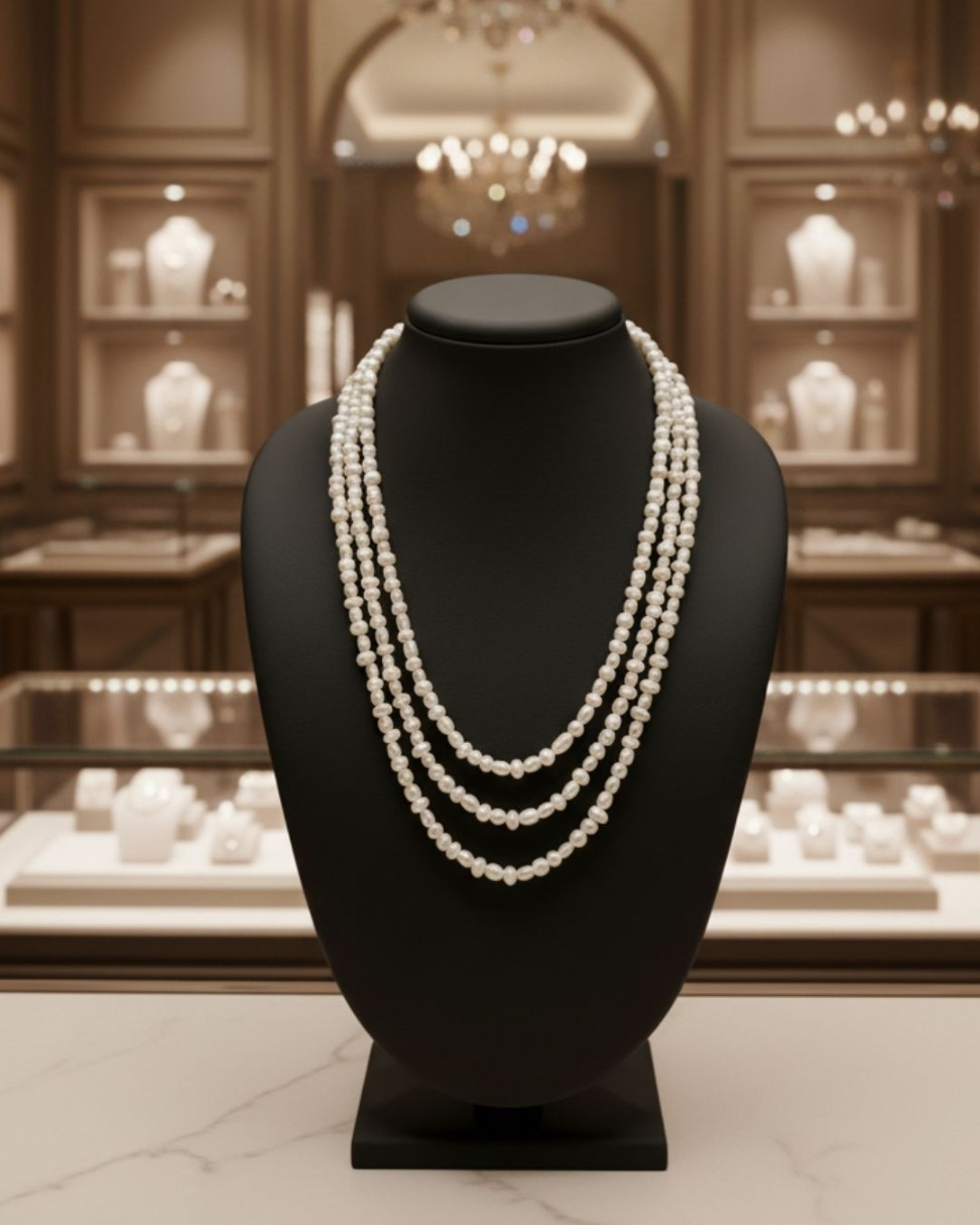 Buy Cascade of Purity freshwater pearl necklace set with cascading white flat and oval freshwater pearls