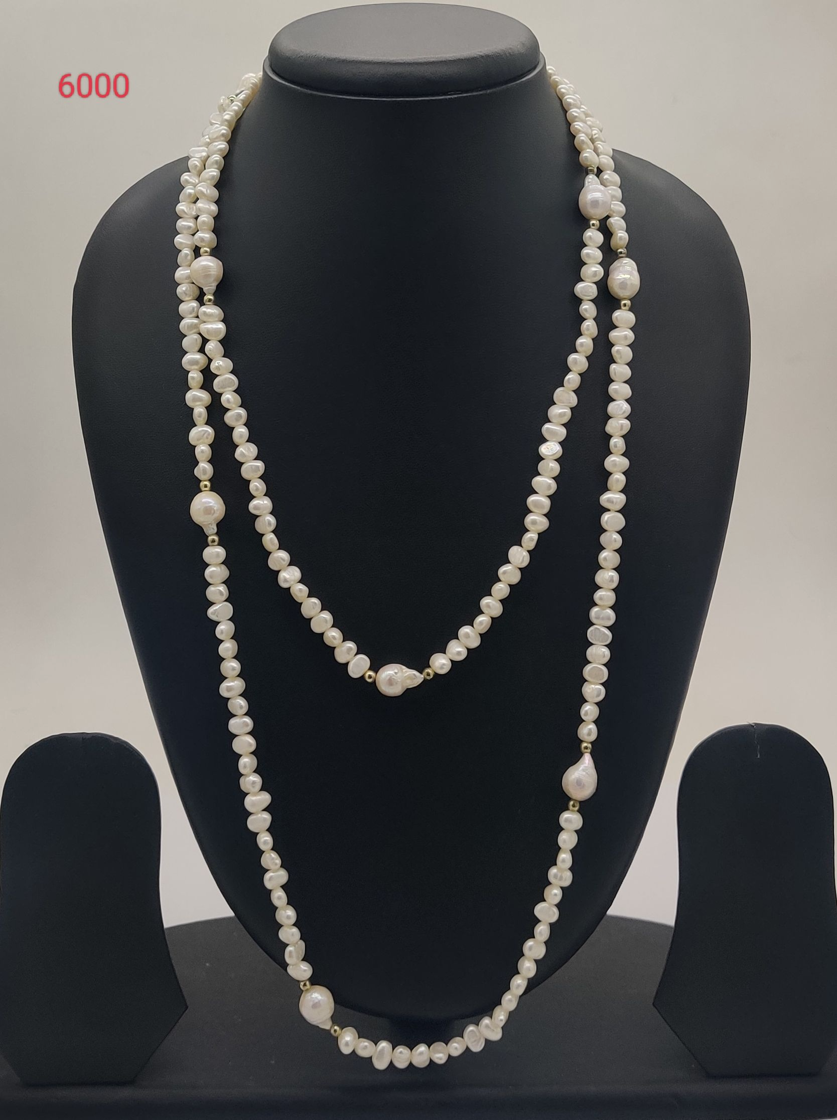 Classic Pearl Harmony freshwater pearl necklace with round and irregular white pearls in layered design
