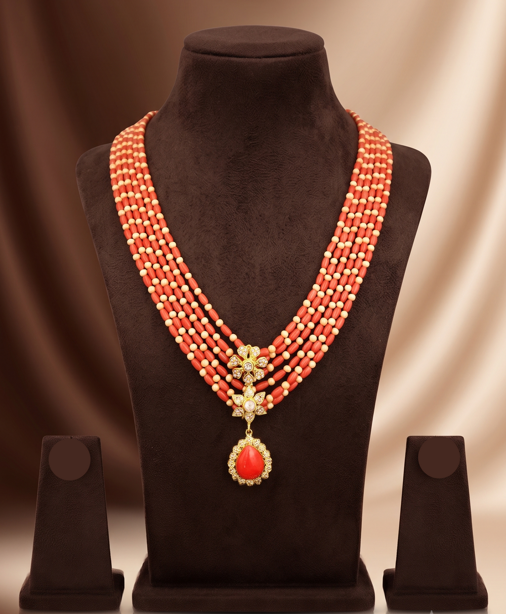 Coral Royale Taiwan coral and Mother of Pearl five layer necklace with floral pendant.