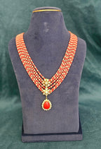 Coral Royale Taiwan coral and Mother of Pearl five layer necklace with floral pendant.