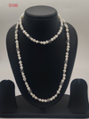 Crystal Cascade freshwater pearl necklace with white pearls and clear faceted beads in layered design