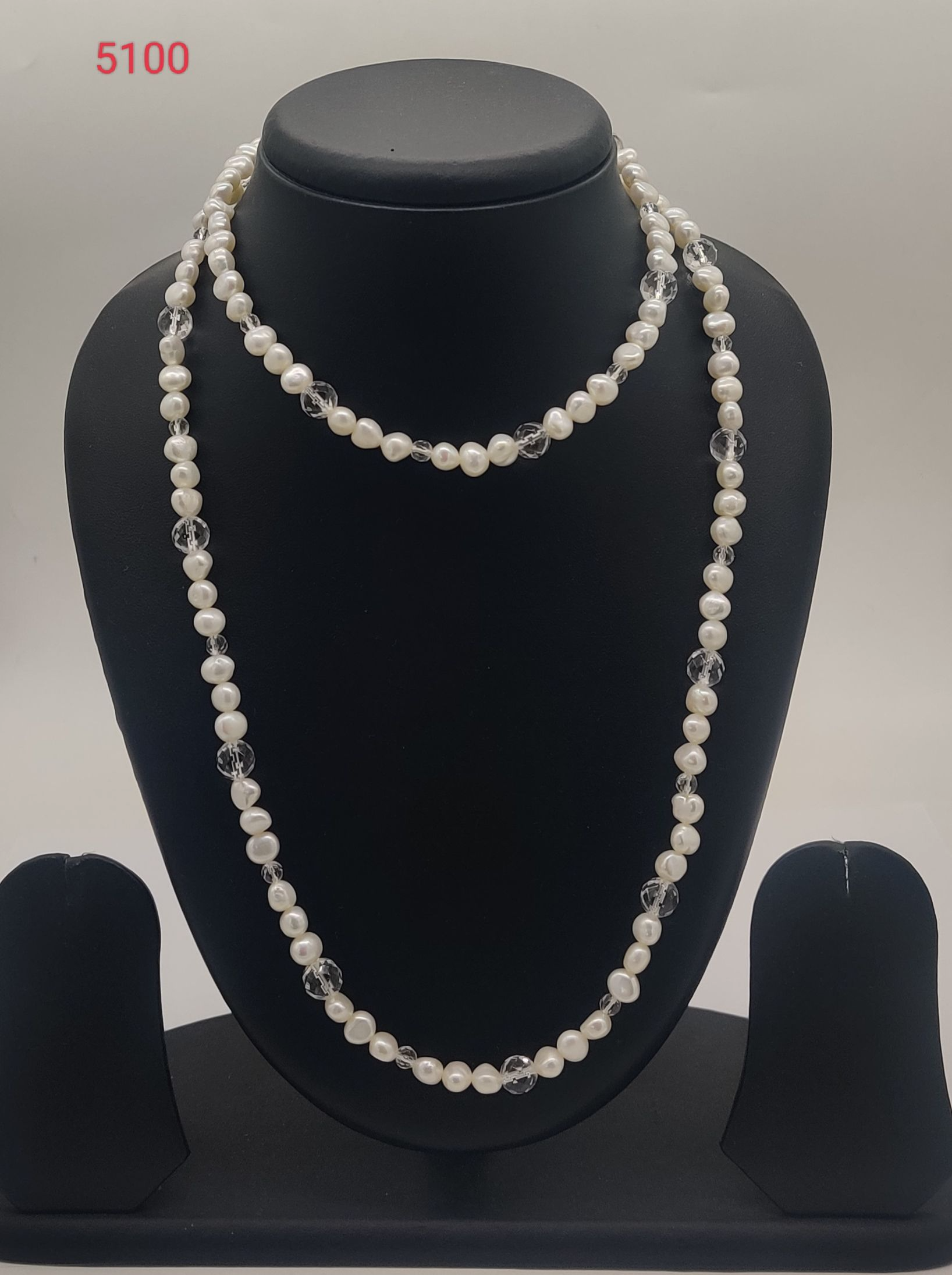 Crystal Cascade freshwater pearl necklace with white pearls and clear faceted beads in layered design