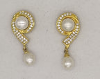 Curved gold tone pearl drop earrings for women