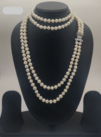 Diamond Bow Grace freshwater pearl necklace set with round white pearls and bow-shaped stone clasp