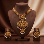 Divine Lakshmi temple necklace set with antique gold finish, peacock motifs, and matching earrings.