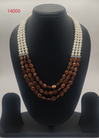 Earth & Ivory Balance freshwater pearl necklace set with round white pearls and brown coin beads in multi-strand design