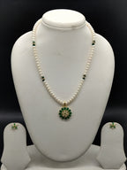 Emerald Bloom freshwater pearl pendant necklace set with white flat pearls and green stone floral pendant