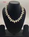 freshwater pearl necklace with clustered pearls and light green beads in floral design