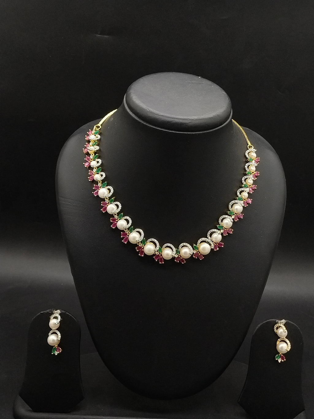 Freshwater pearl choker set with red, green, and white stone floral clusters and matching drop earrings.