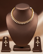 Freshwater pearl choker set with white AD stones, pearl fringe detailing, and matching drop earrings.