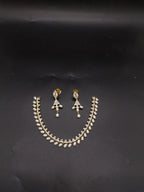 Freshwater pearl choker set with white AD stones, pearl fringe detailing, and matching drop earrings.