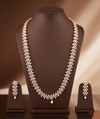 Freshwater pearl long haram set with floral American Diamond motifs and matching earrings.