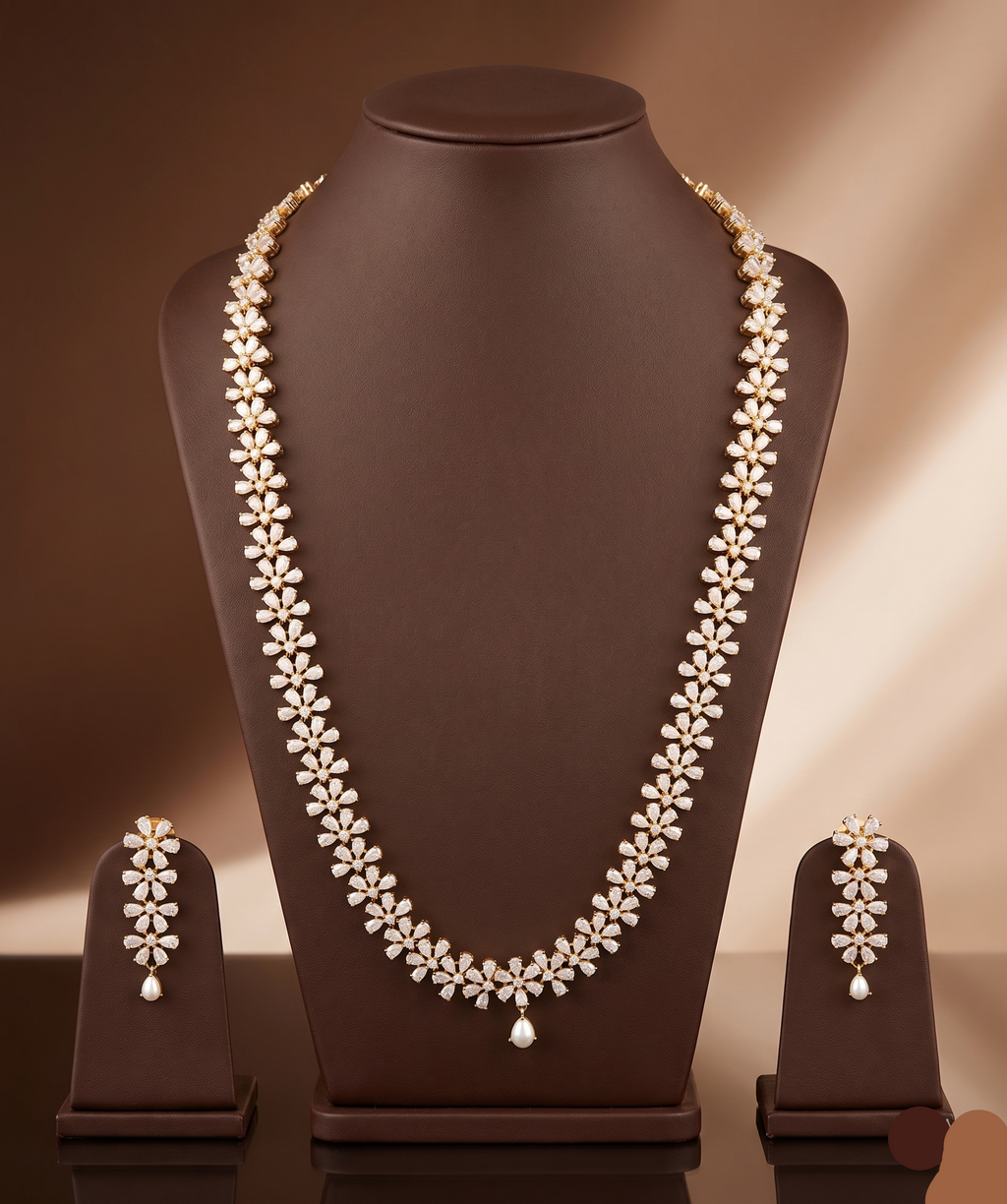 Freshwater pearl long haram set with floral American Diamond motifs and matching earrings.