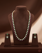 Freshwater pearl long haram set with green and red stone accents and matching drop earrings.