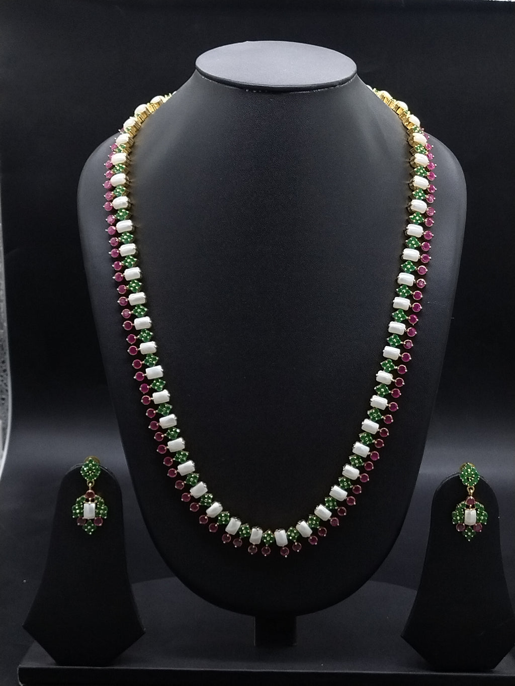 Freshwater pearl long haram set with green and red stone accents and matching drop earrings.