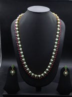 Freshwater pearl long haram set with green and red stone accents and matching drop earrings.