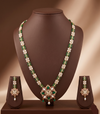 Freshwater pearl long haram set with green, red, and white stone centerpiece and matching earrings.