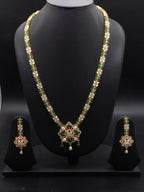 Freshwater pearl long haram set with green, red, and white stone centerpiece and matching earrings.