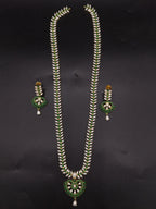 Freshwater pearl long haram set with green stones, floral centerpiece, pearl drop detailing, and matching earrings.
