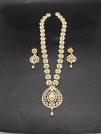 Freshwater pearl long haram set with white AD stones, mandala-style pearl centerpiece, and matching earrings.