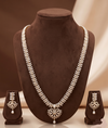 Freshwater pearl long haram set with white AD stones, ornate medallion pendant, pearl drop detailing, and matching earrings.