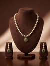 Freshwater pearl necklace set with emerald green teardrop pendant and matching drop earrings