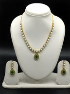 Freshwater pearl necklace set with emerald green teardrop pendant and matching drop earrings