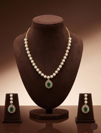 Freshwater pearl necklace set with emerald green teardrop pendant, white CZ halo, and matching drop earrings