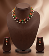 Freshwater pearl necklace set with multicolour stones, floral design, pearl drops, and matching earrings.