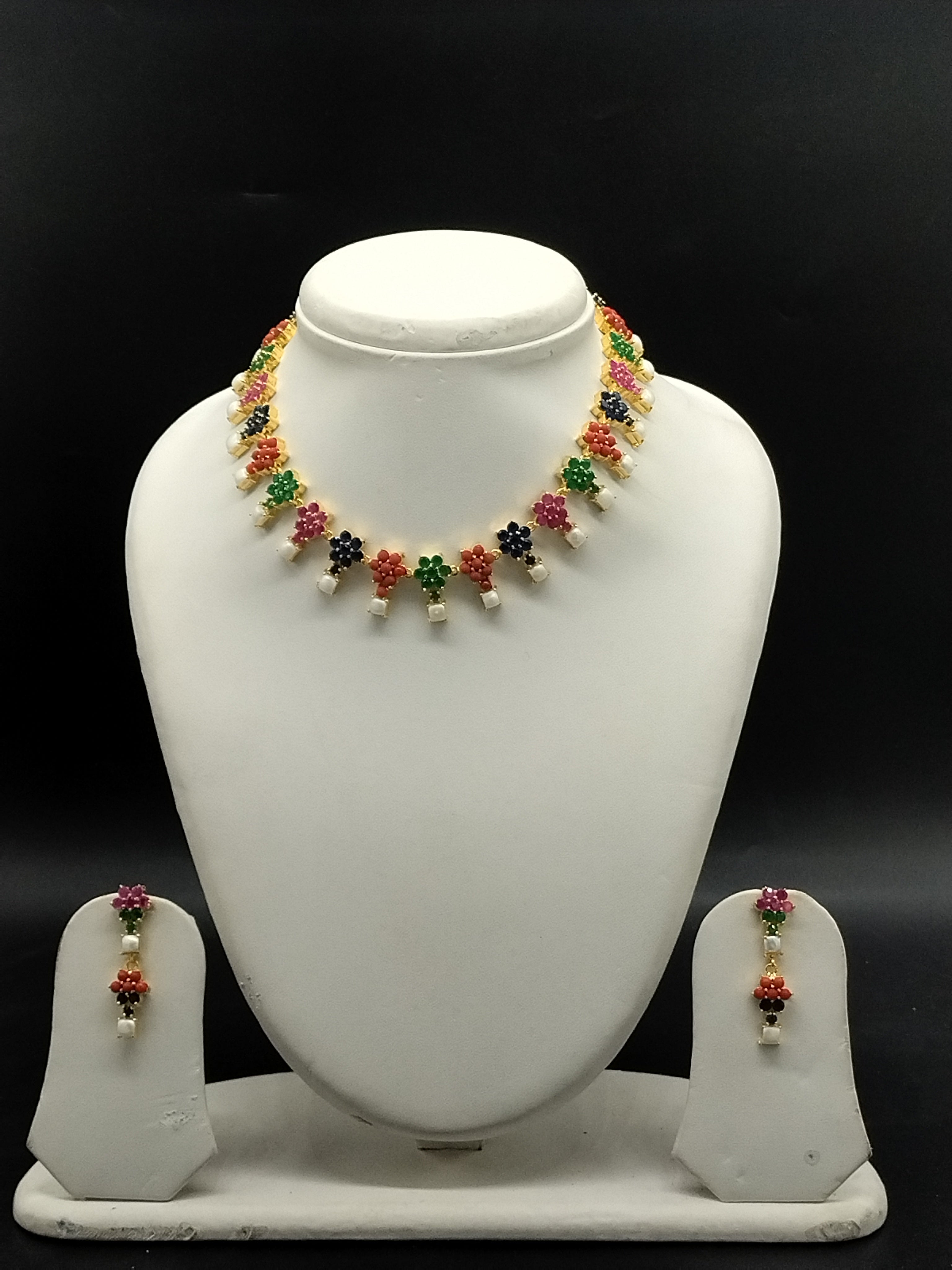 Freshwater pearl necklace set with multicolour stones, floral design, pearl drops, and matching earrings.