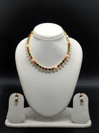Freshwater pearl necklace set with multicolour stones, sparkling CZ floral motifs, and matching drop earrings.
