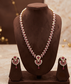The Crimson Chevron: Rice Pearl Long Haar with Ruby Chandbali Pendant Set