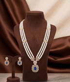 The Royal Sapphire: 3-Line Long Pearl Mala with Blue Stone Medallion Pendant Set