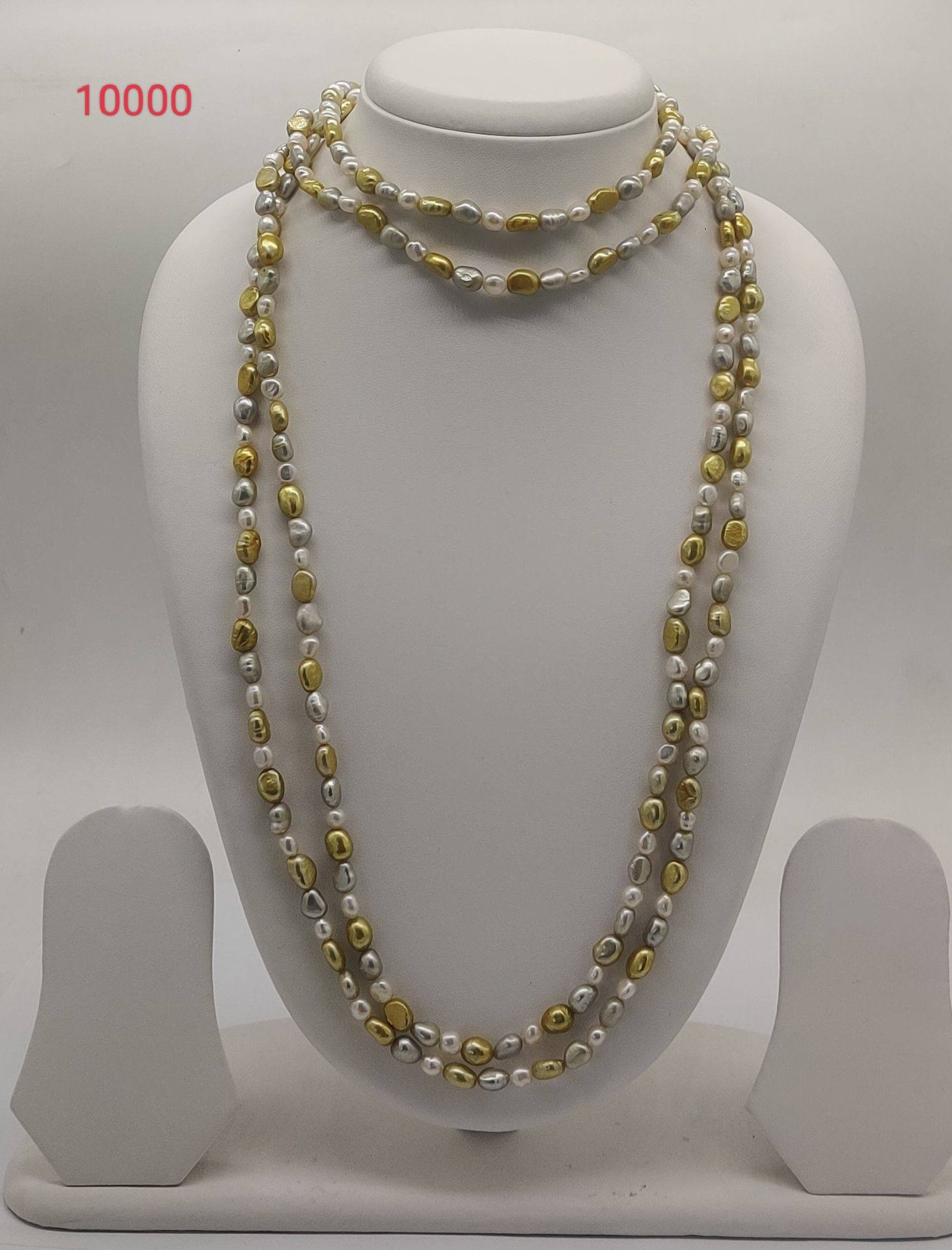 Gilded Harmony freshwater pearl necklace with gold and white pearls in layered multi strand design