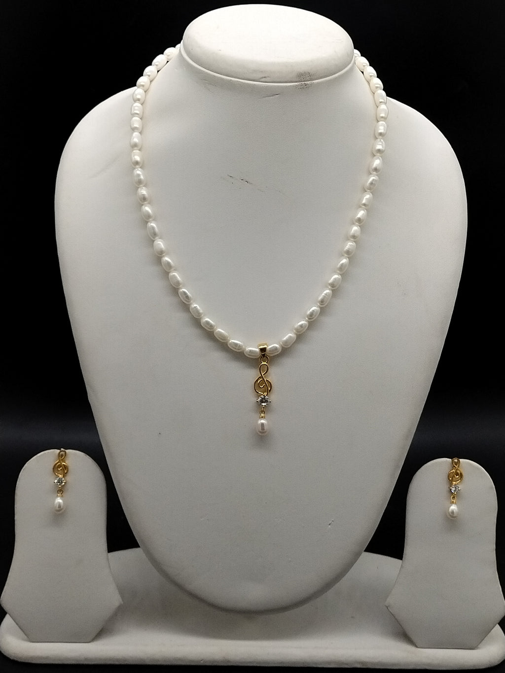 Golden Whisper freshwater pearl pendant necklace set with white oval pearls and minimal gold pendant with pearl drop