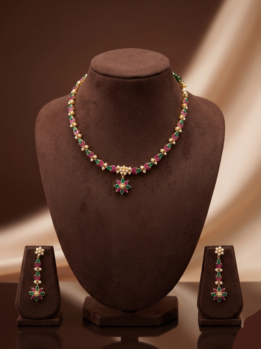 Green and red stone pearl necklace set with floral choker design, freshwater pearls, and matching drop earrings.