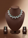 Green and white American Diamond necklace set with emerald-inspired stones and matching drop earrings