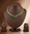 Green and white stone designer choker set with asymmetrical wrap-around design and matching stud earrings.