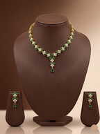 Green and white stone necklace set with floral motifs and matching drop earrings.