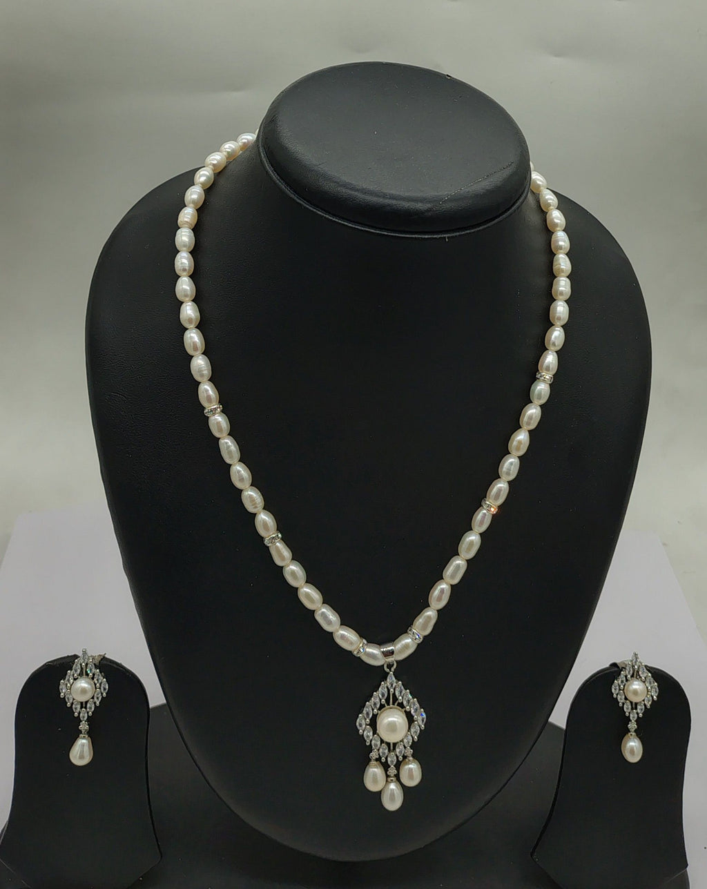 One line freshwater pearl necklace and earrings set with celestial bloom pendant and oval pearls