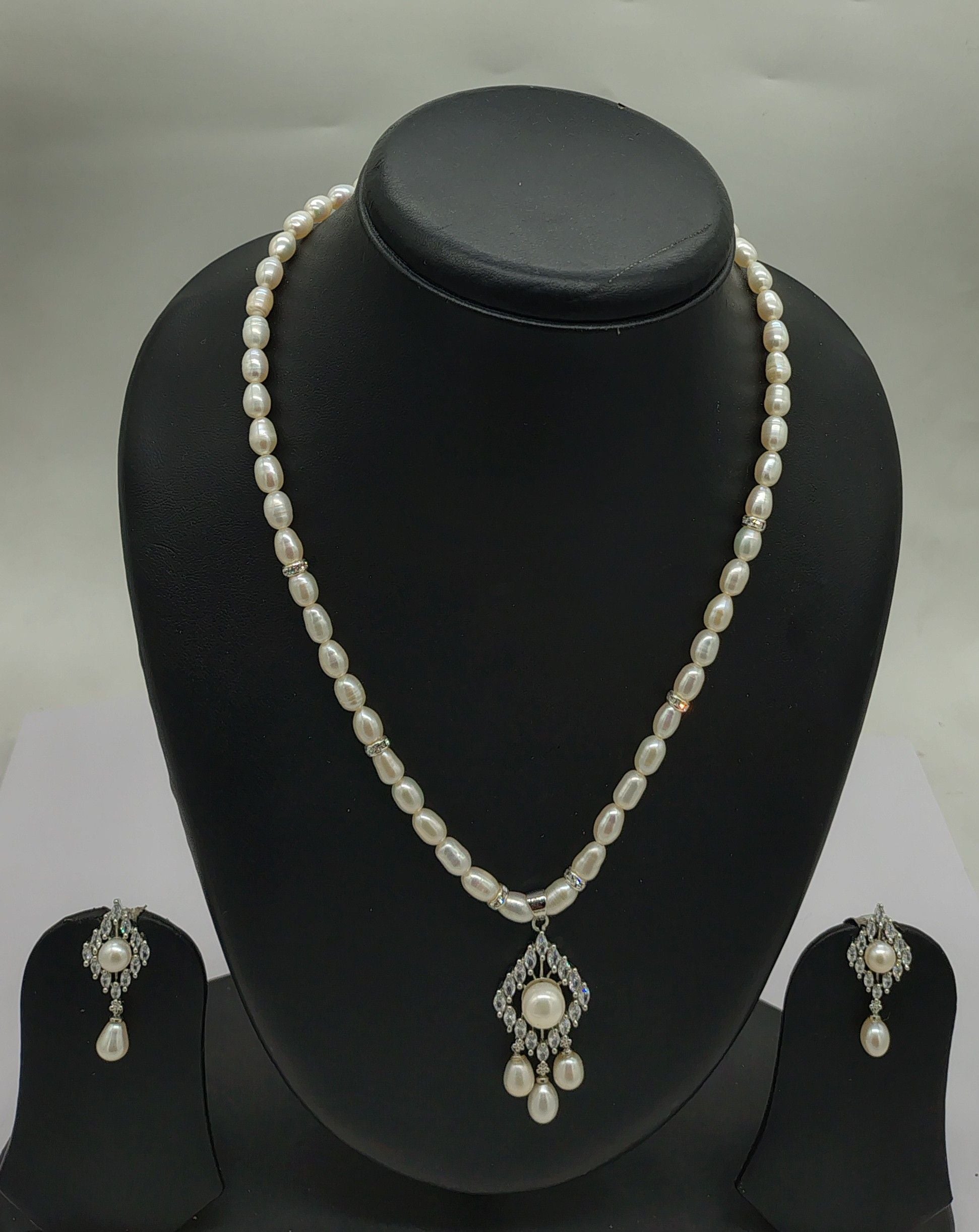 One line freshwater pearl necklace and earrings set with celestial bloom pendant and oval pearls