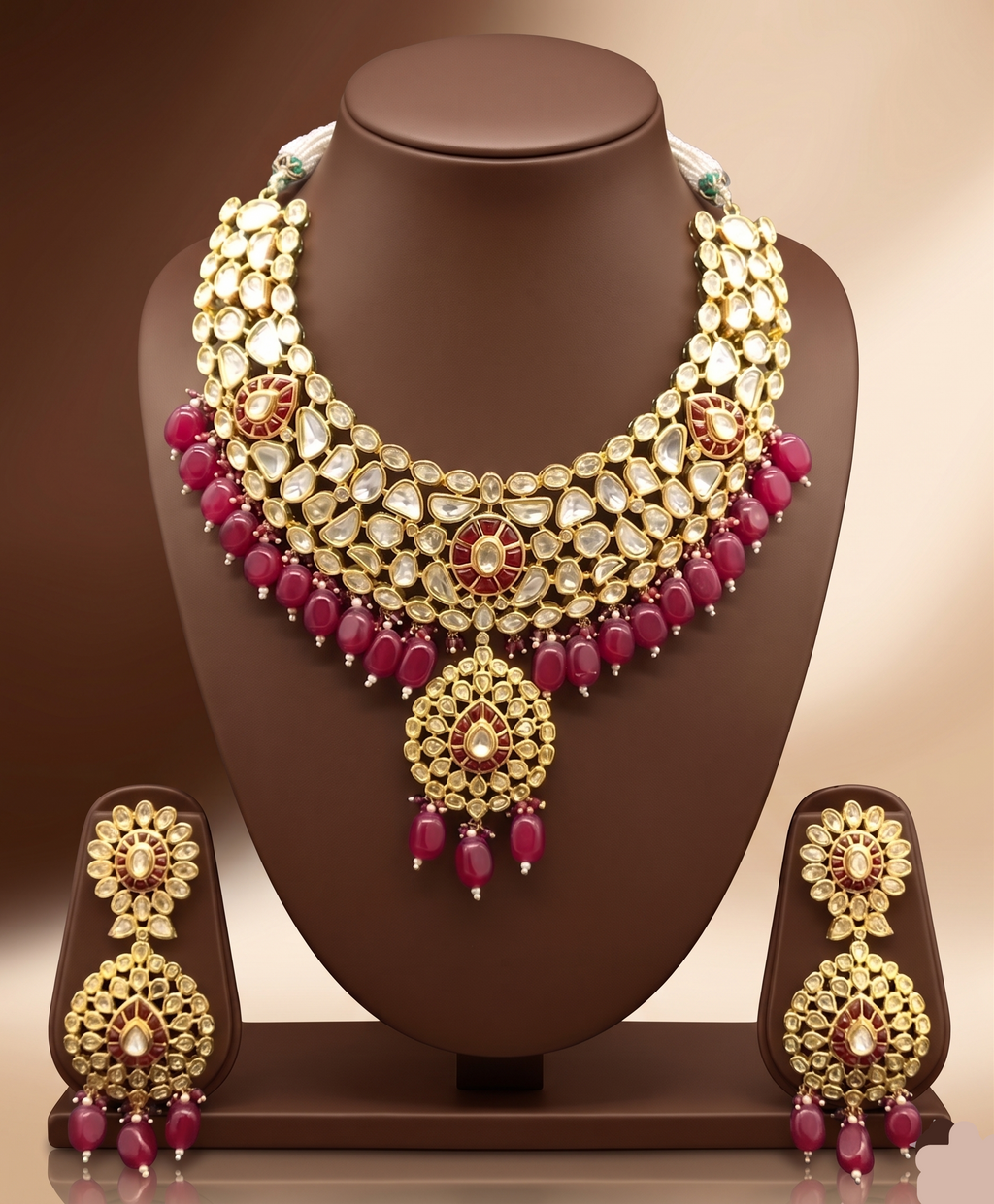 Kundan choker set with white stone detailing, red bead accents, and matching statement earrings.